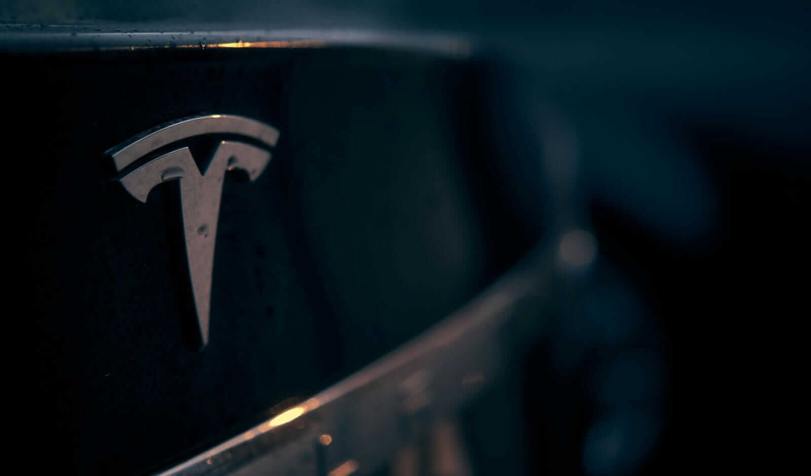 Tesla car with symbol by Michael Fortsch via Unsplash